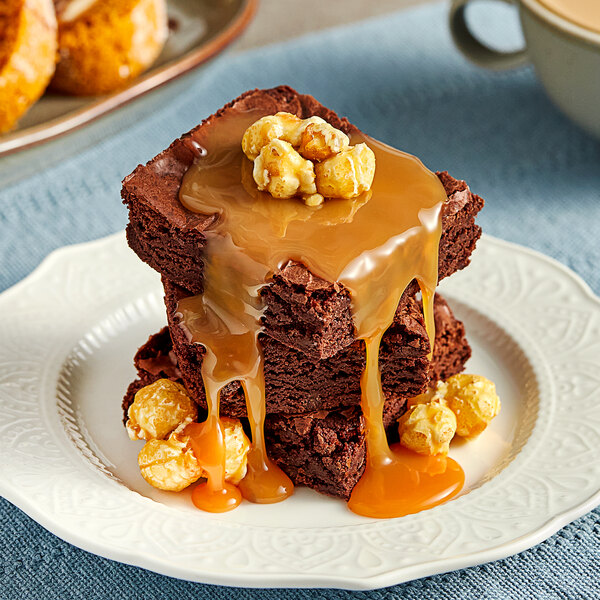 A stack of Lyons brownies drizzled with Sea Salt Caramel Flavoring Sauce.