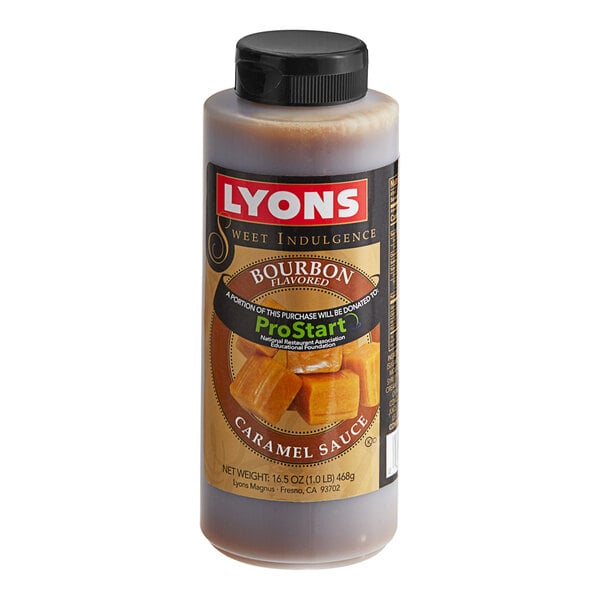 A bottle of Lyons Sweet Indulgence Bourbon Caramel Flavoring Sauce on a table.