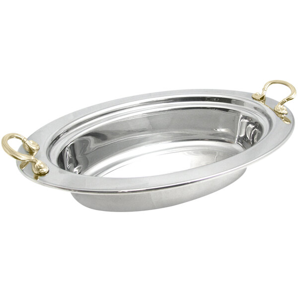 A silver stainless steel oval food pan with round brass handles.