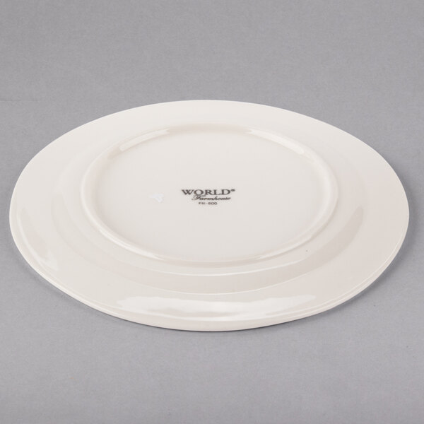 A white Libbey porcelain plate with a medium rim.