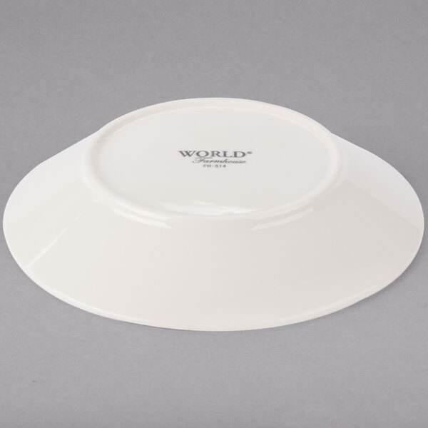 A white Libbey porcelain soup and salad bowl with a logo on it.