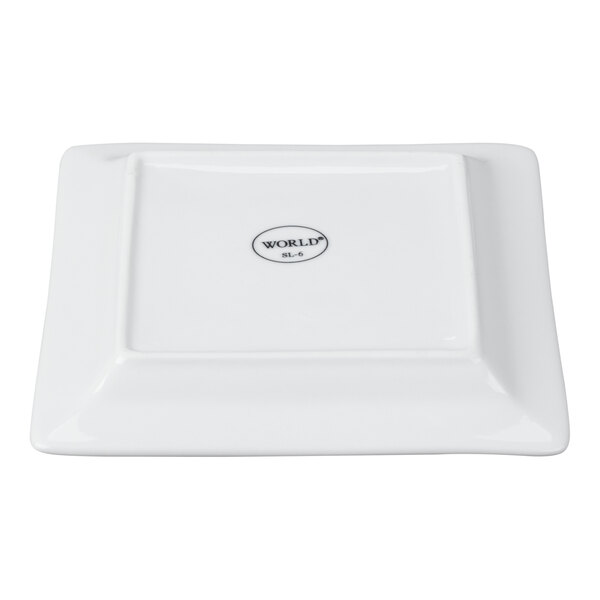 A white square porcelain plate with a wide rim and a small logo in the center.