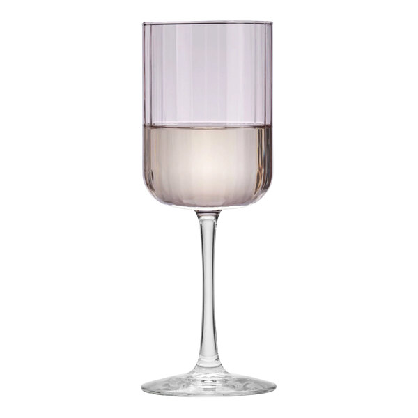 A close-up of a Libbey wine glass with a pink rim containing liquid.