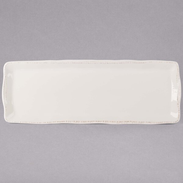 A white rectangular porcelain tray with a small handle.