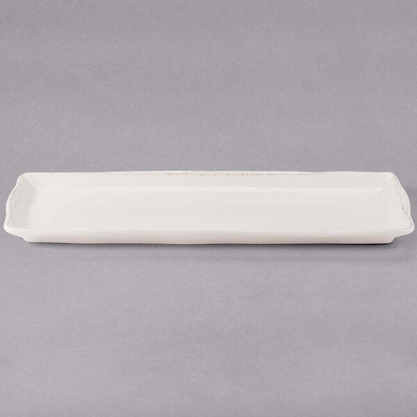 A white rectangular Libbey porcelain tray with a brown border.