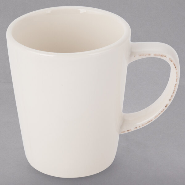 A white Libbey porcelain mug with a handle.