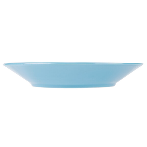 A blue bowl with a white hen design.