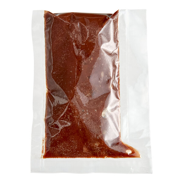 A plastic bag of Clown single-serve chocolate icing with white label.