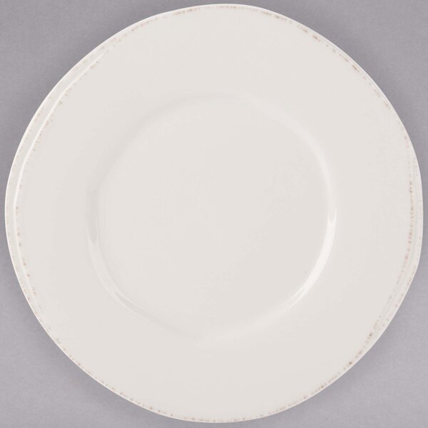 A white Libbey porcelain plate with a wide rim.
