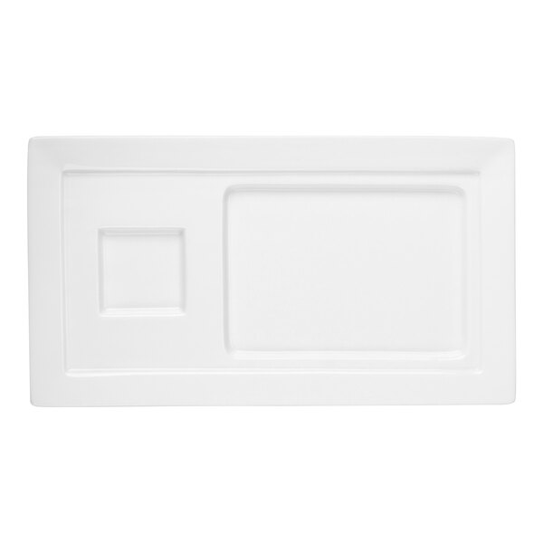 A rectangular white porcelain tray with two recessed sections, one square and one rectangular.