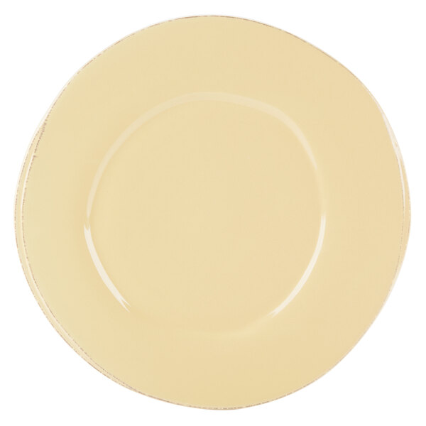 A white porcelain plate with a wide circular yellow rim.
