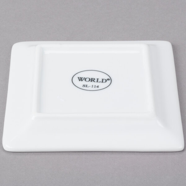 A Libbey Ultra Bright White Wide Rim Square Porcelain Plate with black text that reads "World"