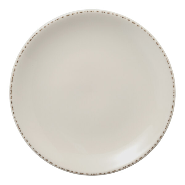 A white Libbey Farmhouse Coupe porcelain plate with brown speckled trim.