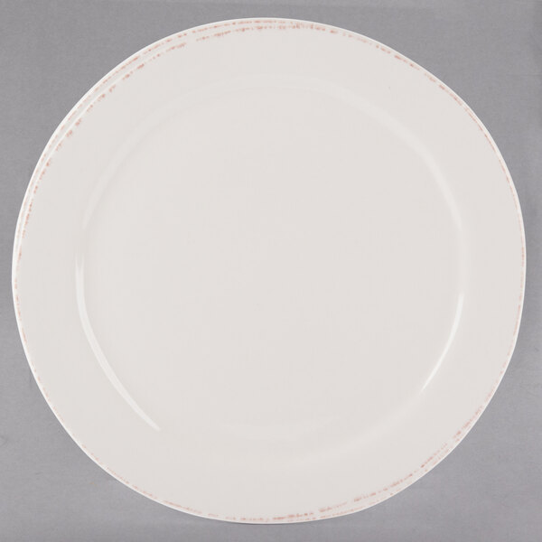 A white Libbey Farmhouse porcelain plate with a medium rim.