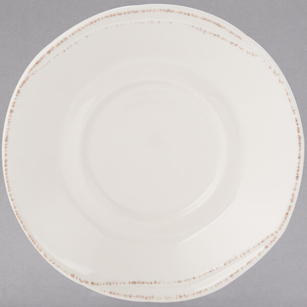 A Libbey round cream porcelain saucer with a brown border.