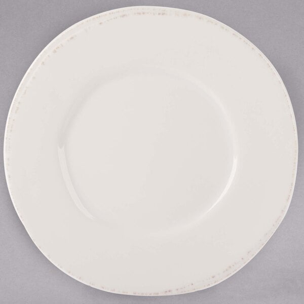 A white Libbey porcelain plate with a wide rim.