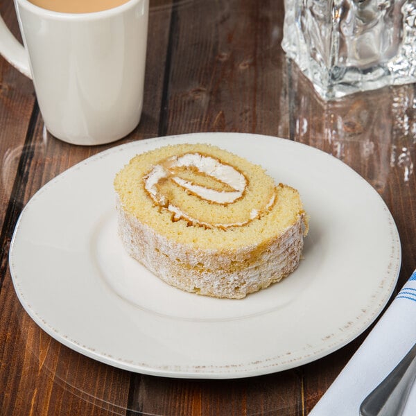 A Libbey Farmhouse round white porcelain plate with food on it.