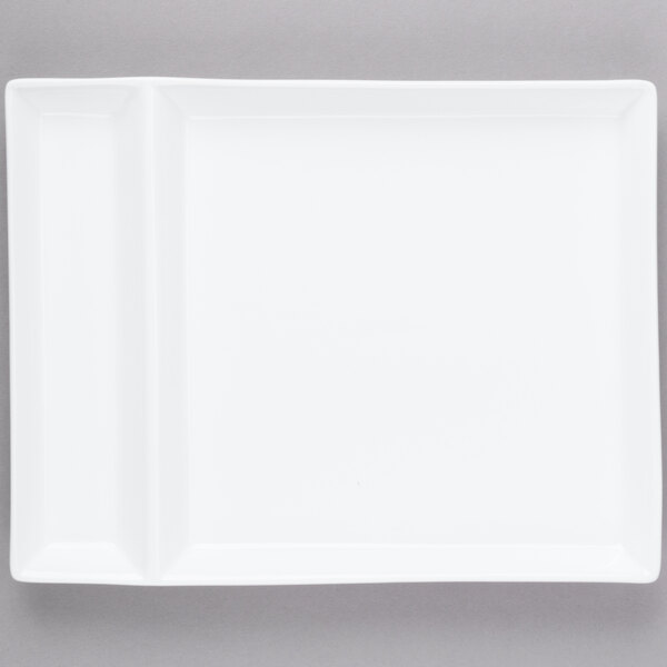 A white rectangular plate with two small square cut outs.