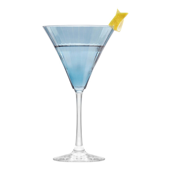 A Libbey blue martini glass with blue liquid and a lemon wedge.