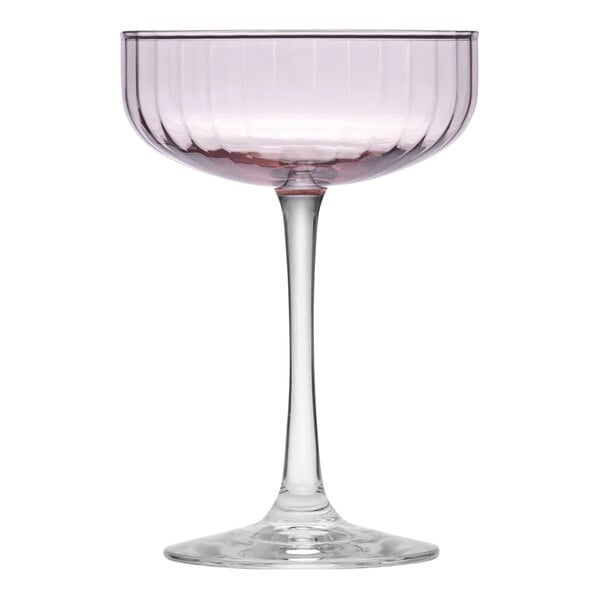 A Libbey pink coupe glass with a stem and a pink liquid in it.