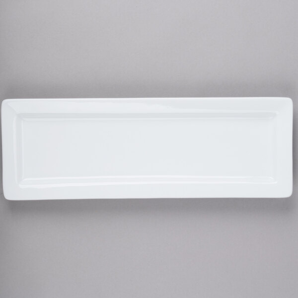 A white rectangular plate with a wide rim.