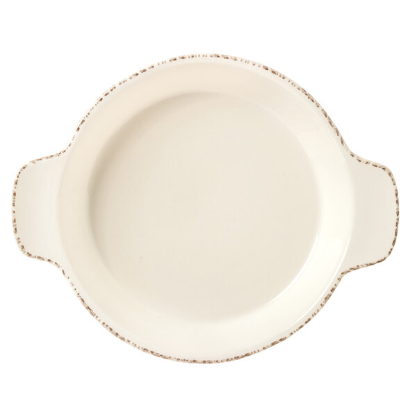 A white round porcelain skillet with a handle.