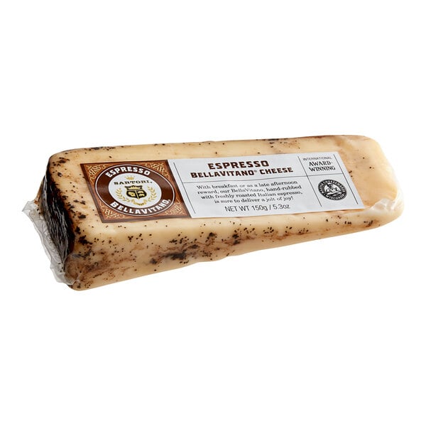 A rectangular wedge of Sartori Espresso BellaVitano cheese with a label on it.