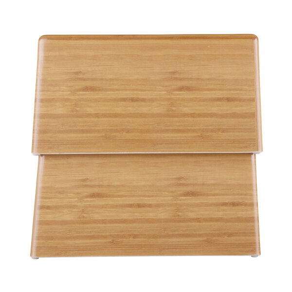 A rectangular faux bamboo wood display riser with two compartments on top.