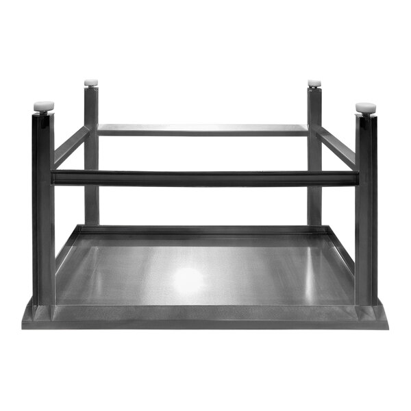 A stainless steel work table with a metal frame.