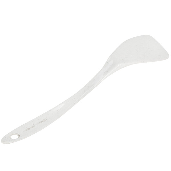 A white plastic spatula with a bamboo handle.