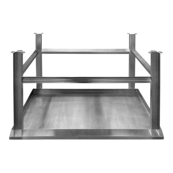 A SSL Industries stainless steel work table with metal paw print footing.