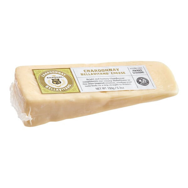 A wedge of Sartori Chardonnay BellaVitano cheese with a label on a white background.