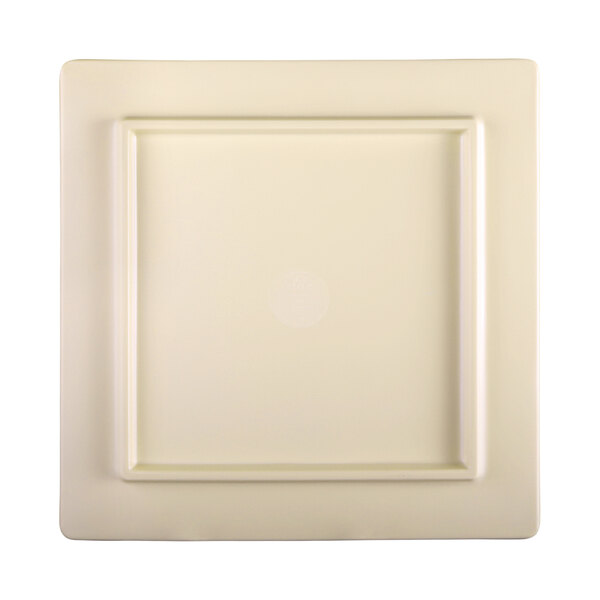 A white square melamine serving board with a faux walnut square border and a square in the middle.