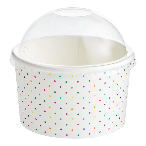 A white Choice paper cup with a polka dot lid and polka dots on the container.