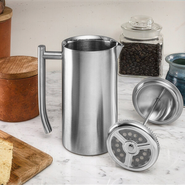 A Frieling stainless steel French press on a counter.