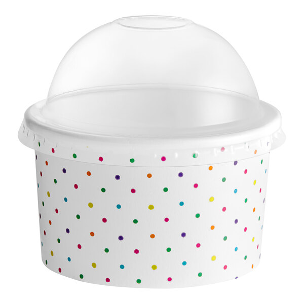 A white container with colorful polka dots on it.