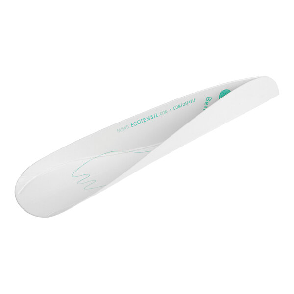 A white paper EcoTensil spoon with blue writing and a green logo.