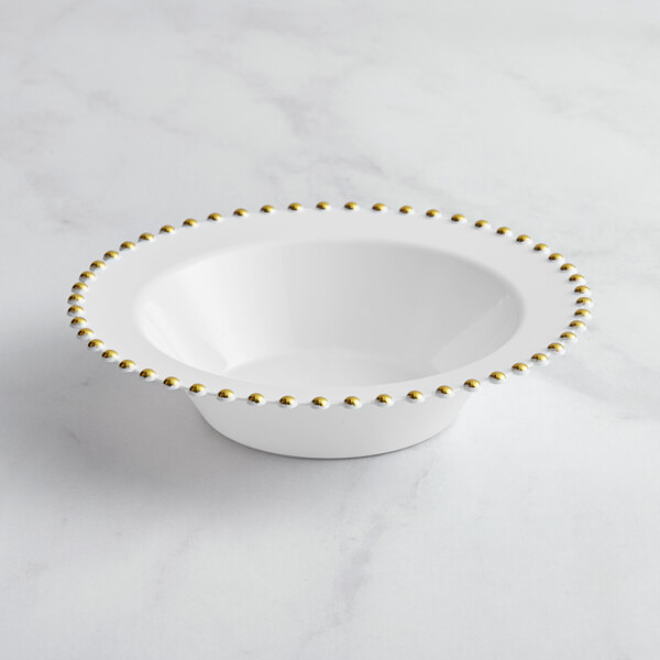 A white plastic bowl with gold beaded trim.