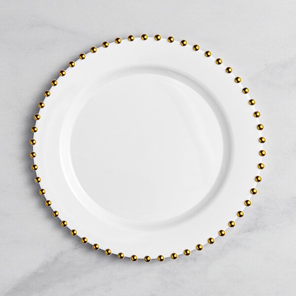 A white Visions plastic plate with gold beaded rim.
