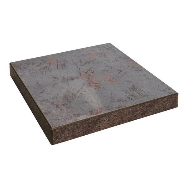 A BFM Seating Relic rustic copper square melamine table top sample with a grey surface and brown spots.