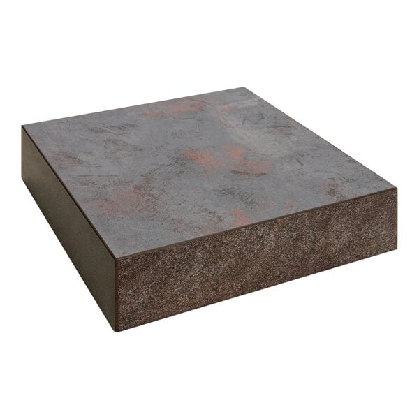 A BFM Seating Relic rustic copper melamine square table top with matching edge on a table.