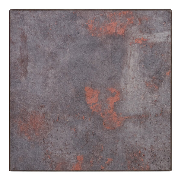 A white square table top sample with a rustic copper design.
