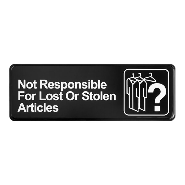 A black sign with white text that says "Not Responsible for Lost or Stolen Articles"