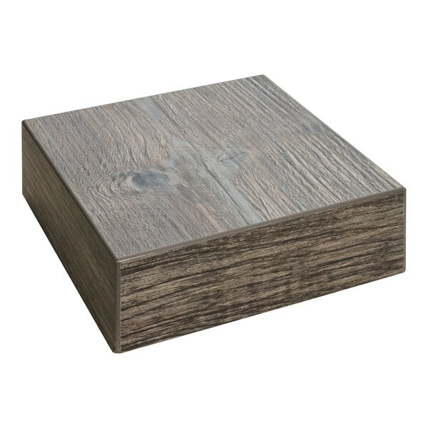 A BFM Seating driftwood laminate square table top sample.