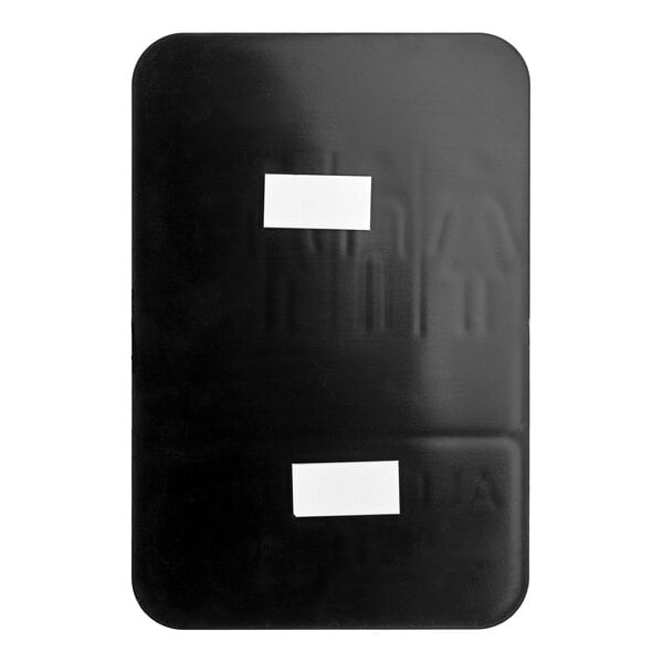 A white rectangular object on a black surface with two white labels reading "All Gender Restroom" and "Braille"