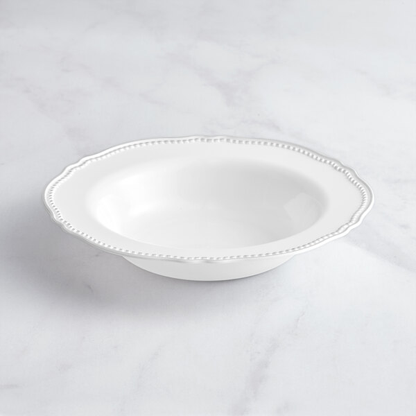 A white Visions plastic bowl with a beaded silver rim.