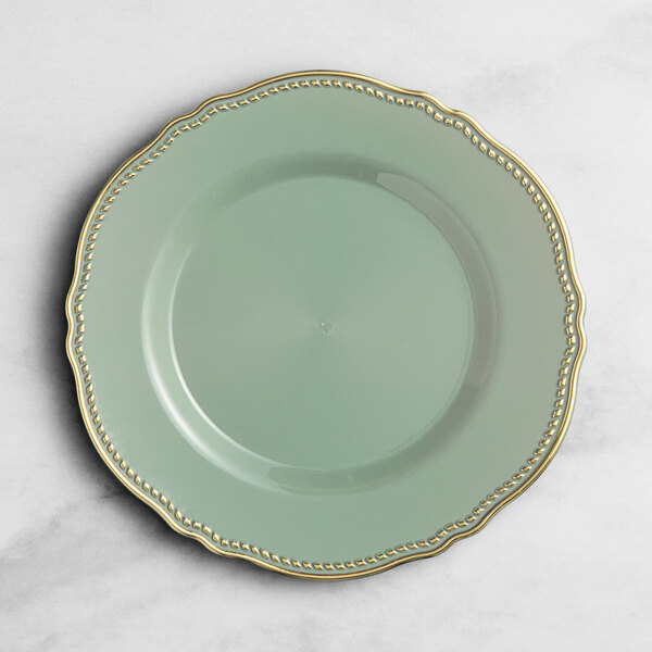 A Visions eucalyptus green plastic plate with a gold vintage rim.