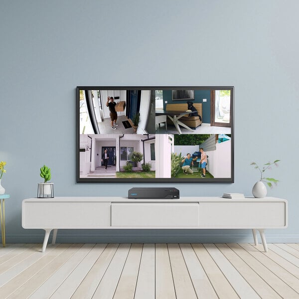 A white and grey surface with a black Reolink Smart Network Video Recorder box on it.