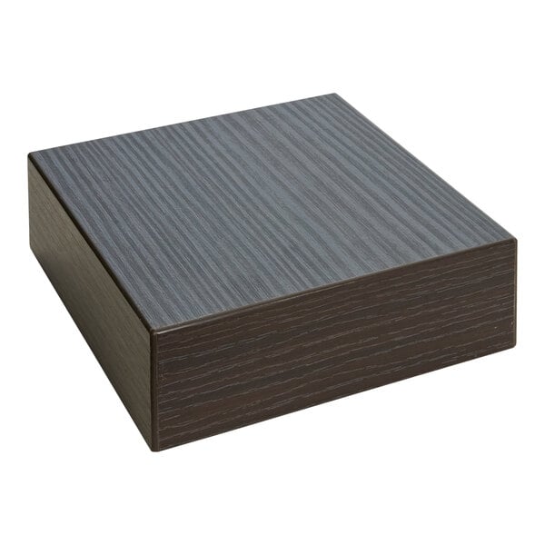 A black square BFM Seating Midtown laminate table top sample with white lines.