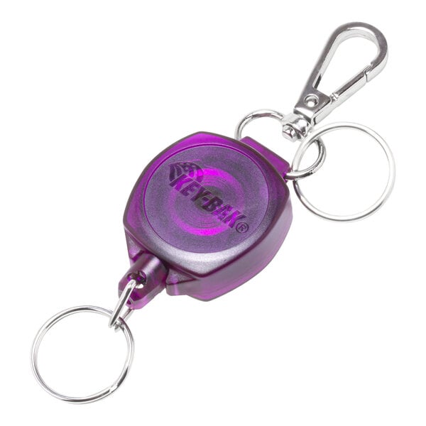 A KEY-BAK translucent purple keychain with attached keyring.